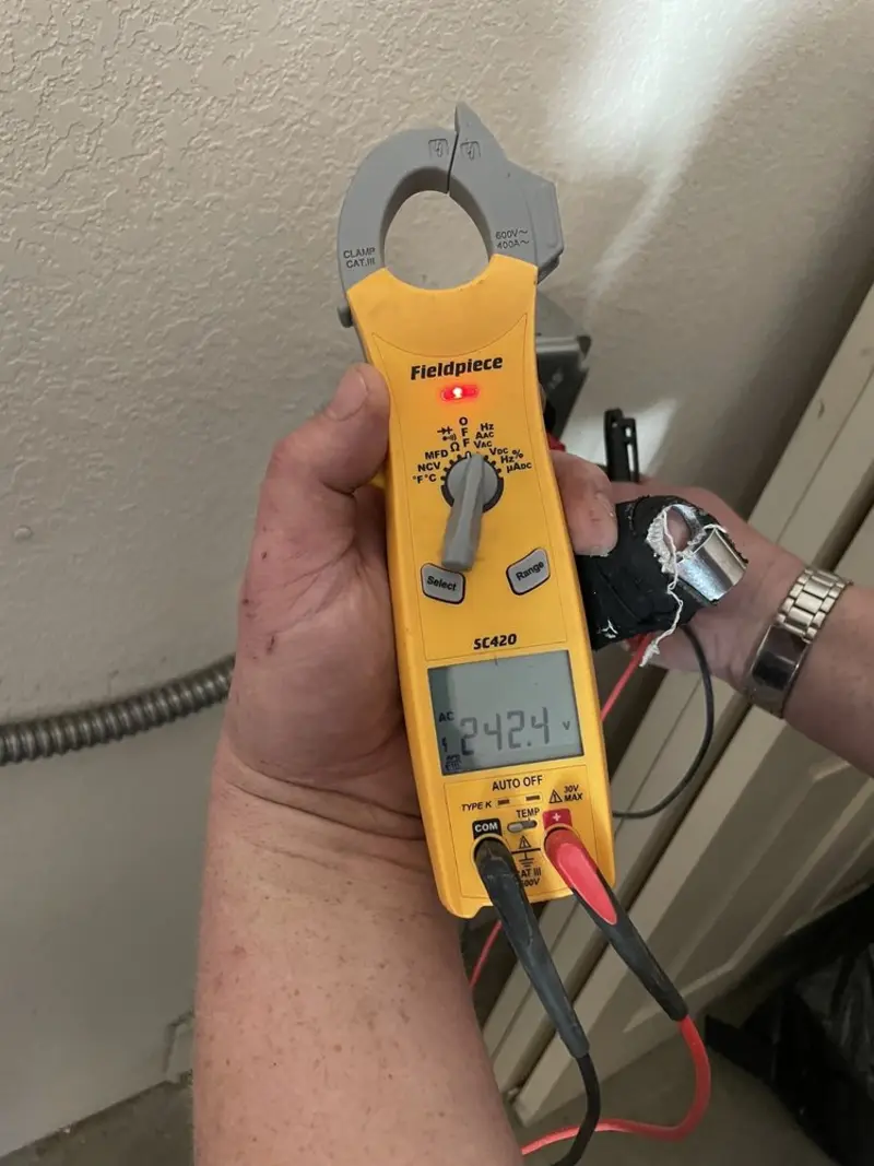 Voltage testing with clamp meter during Generator Installation in Southport